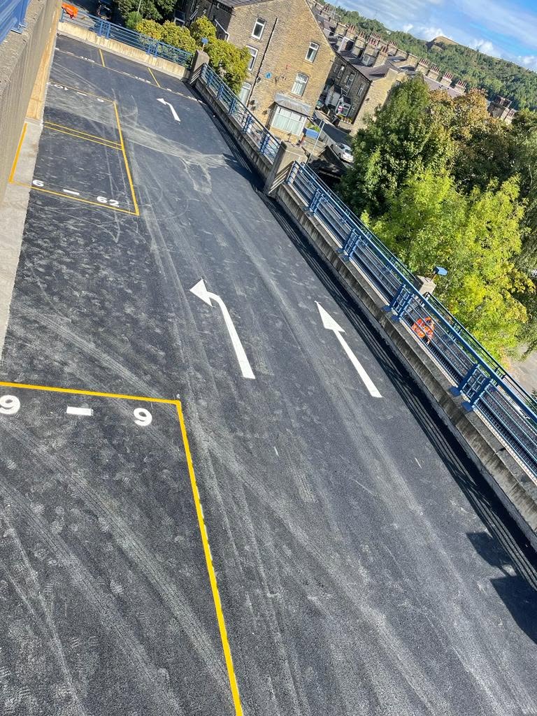 Multi-storey car park ramp resurfaced with new arrows and bay markings