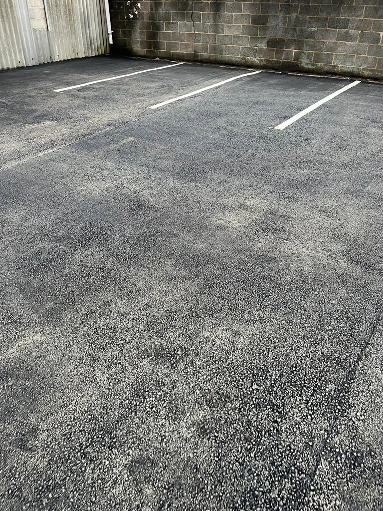 Freshly surfaced car park bays with new white lines
